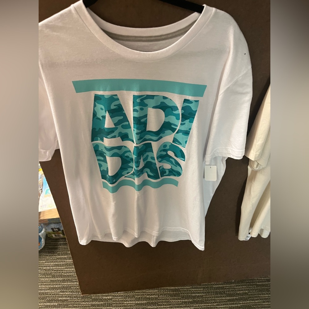 White top with light blue design